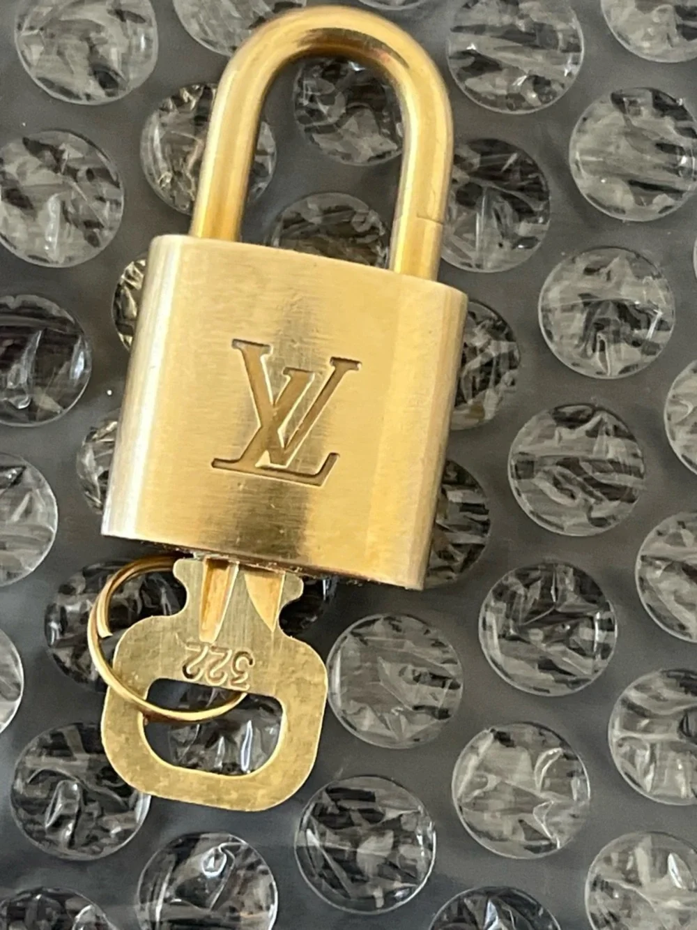 Louis Vuitton polished gold